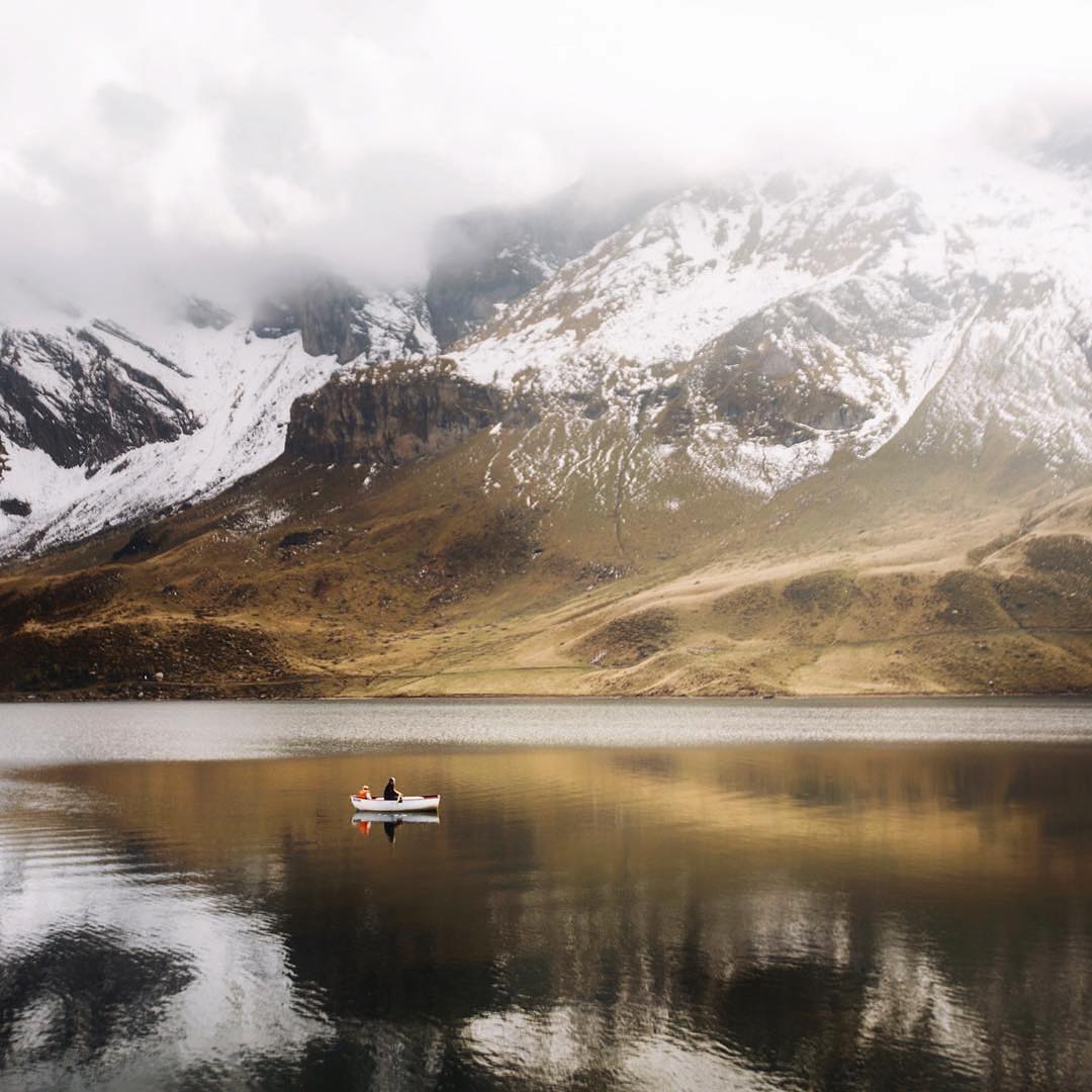 #Repost @myswitzerlandHi everyone! This is @claireonline, day 2 of the takeover. Yesterday, I arrived at Melchsee-Frutt, located at 1,920 metres (6,300 ft) above sea level. This tiny boat slowly passed by as you heard nothing but silence… What an amazing place! #inLOVEwithSwitzerland #mylucerne #LakeLucerneRegion #melchseefrutt